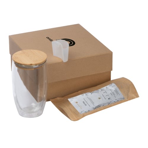 Coffret cadeau de th multicolore avec verre, couvercle en bambou et accessoires.