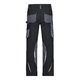 Pantalon de travail noir et gris en polyester et coton avec plusieurs poches.